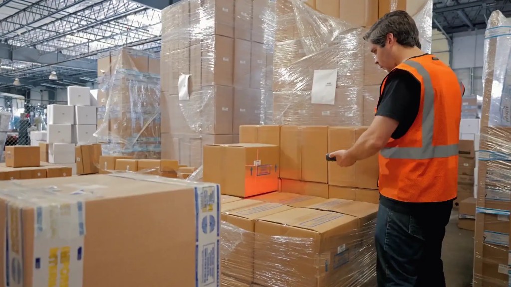 Warehouse associate scanning inventory at Rewashi Cube