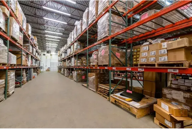 High-bay pallet racks in a Rewashi Cube warehouse aisle
